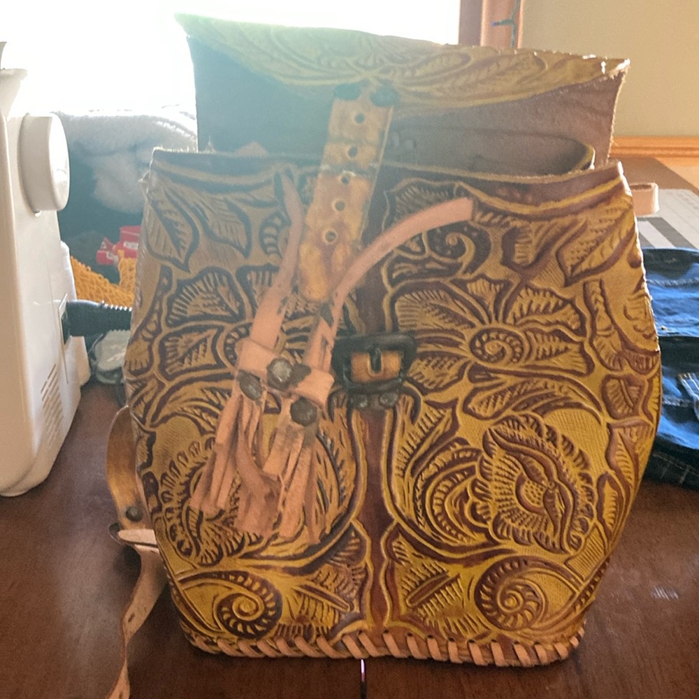 Stylish Yellow and Brown Backpack with Intricate Design